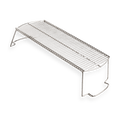 Stainless steel grill warming rack with raised legs on white background