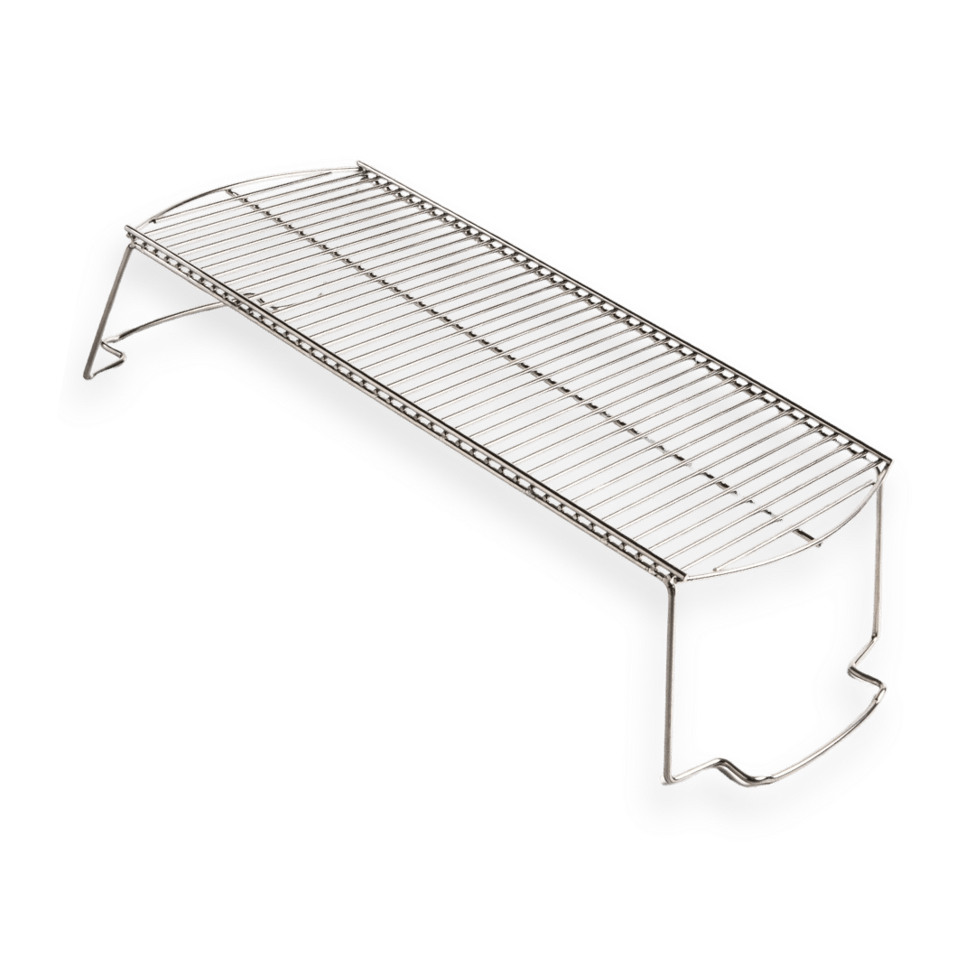 Stainless steel grill warming rack with raised legs on white background